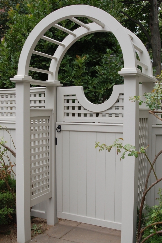 Elegant White Arched Garden Gate with Trellis