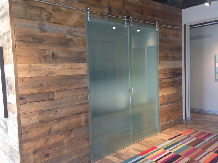 Frosted Glass Barn Doors with Rustic Wood Wall