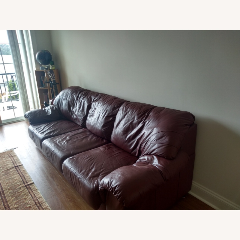 Large Maroon Leather Sofa in Modern Living Room