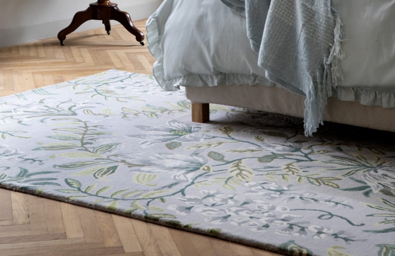 Laura Ashley Floral Pattern Rug on Parquet Floor