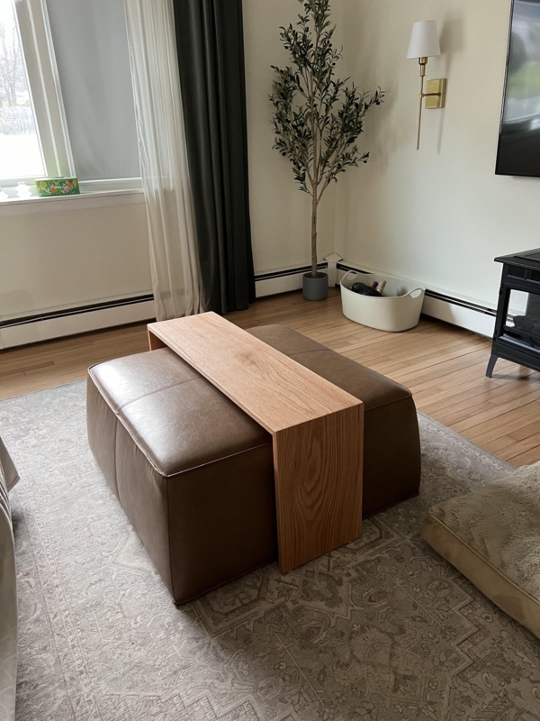 Minimalist Wooden Coffee Table Over Leather Ottoman