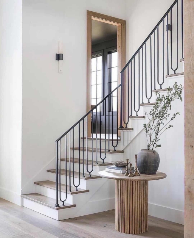 Modern Black and White Staircase with Wall Sconces
