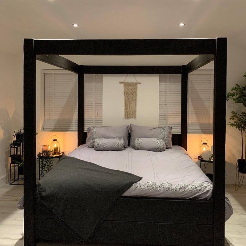 Modern Black Four-Post Bed with Minimalist Decor