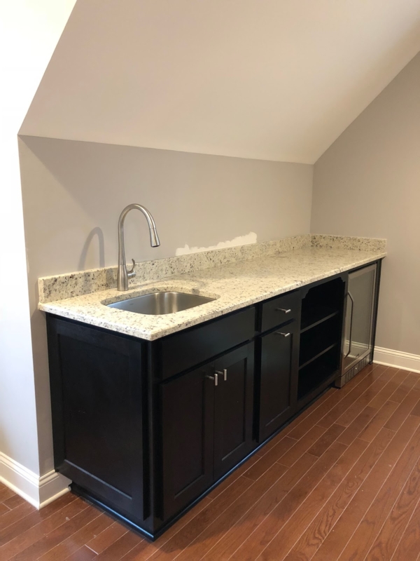 Modern DIY Wet Bar with Granite Countertop and Black Cabinets