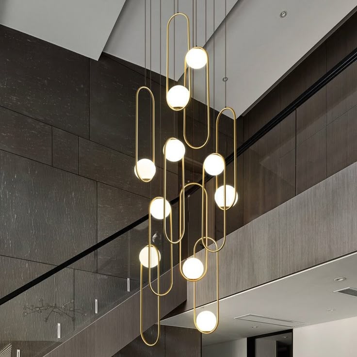 Modern Minimalist Gold Chandelier by Staircase