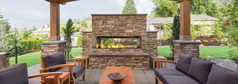 Modern Stone Outdoor Fireplace with Seating Area