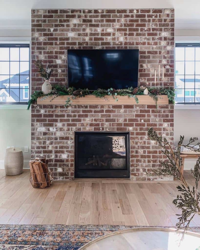 Rustic Brick Fireplace Wall with Mounted TV