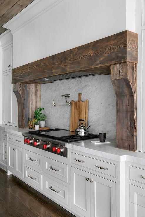 Rustic Farmhouse Range Hood with White Cabinetry