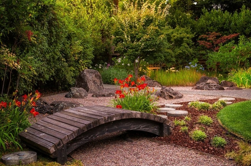 Rustic Wooden Garden Bridge with Lush Greenery