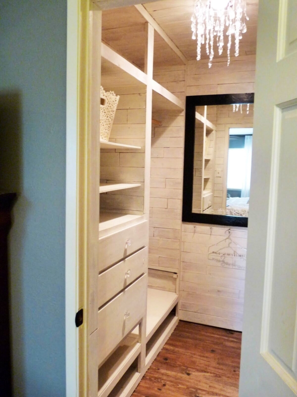 Small Cozy Closet with Chandelier Lighting