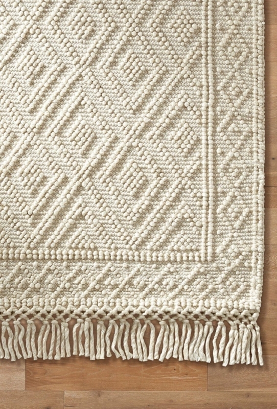 Textured Cream Wool Area Rug with Fringe