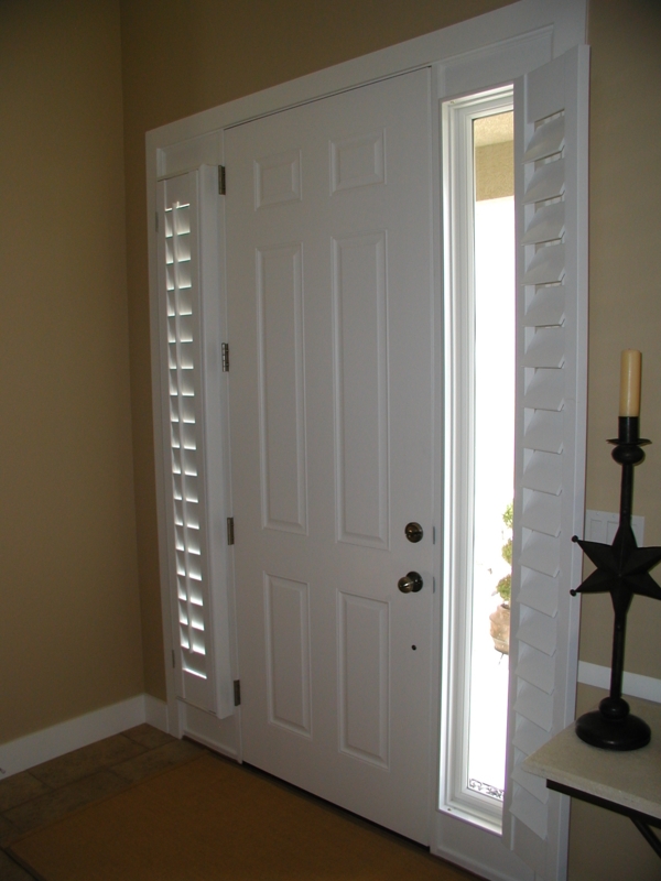 White Sidelight Shutters Enhancing Front Door Entry