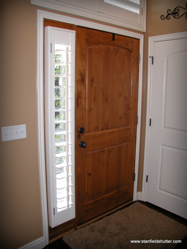 Wooden Front Door with White Sidelight Shutters