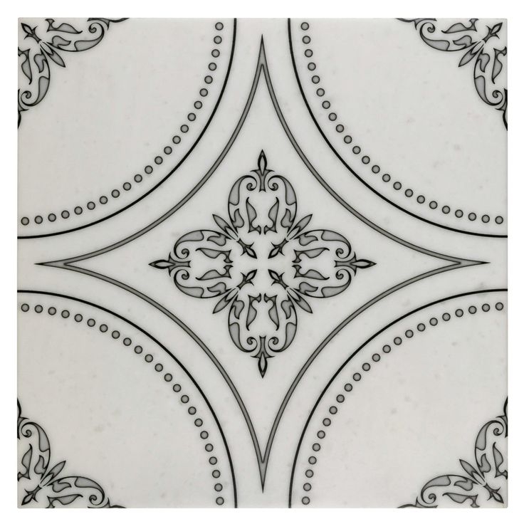 an ornate tile pattern with black and white designs on the sides, in ...