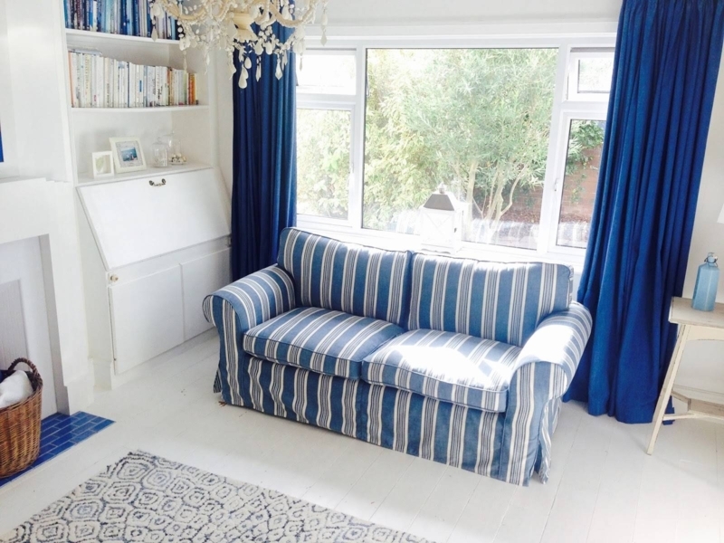 Blue and White Striped Sofa in Bright Living Room
