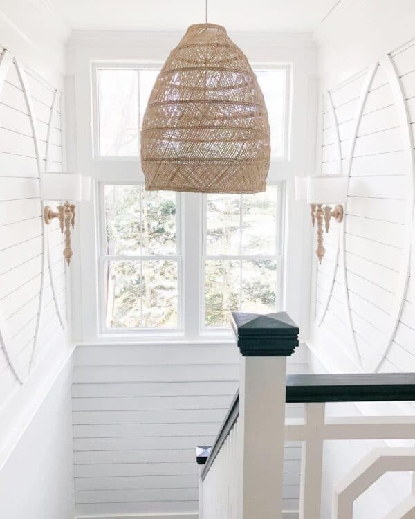 Bright and Cozy Stairway with Wall Sconces