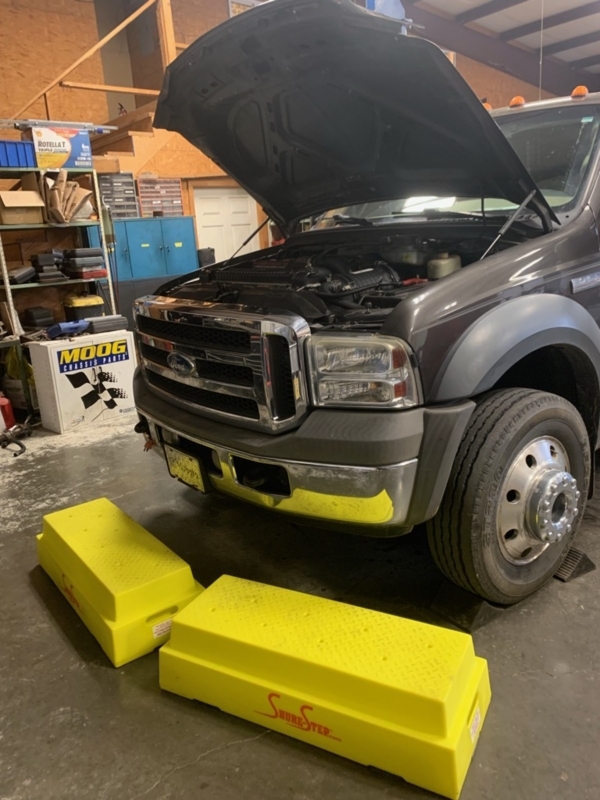 Bright Yellow Step Stools for Heavy Duty Truck Maintenance