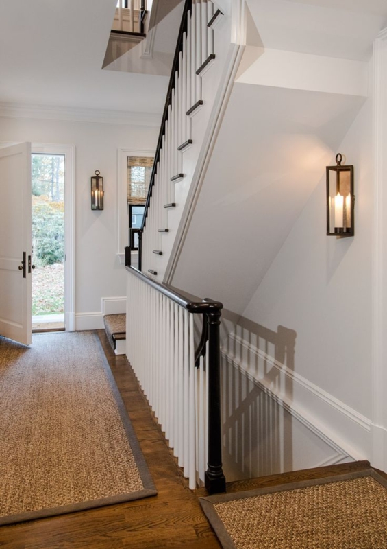 Bronze Lyford Wall Sconce in Bright Stairwell