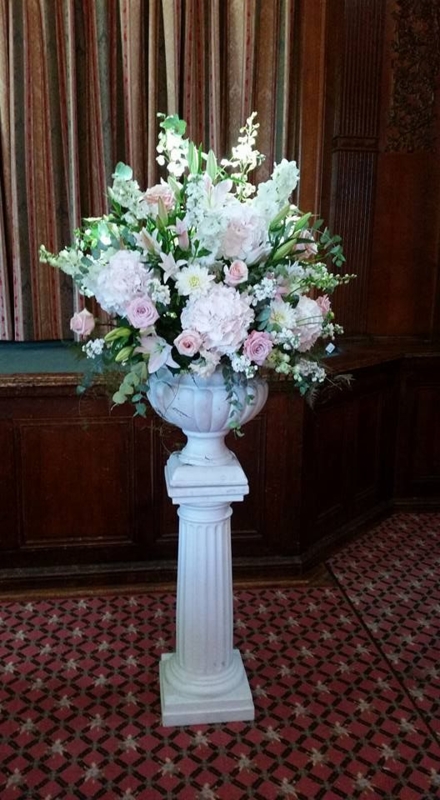 Classic White Pedestal with Elegant Floral Arrangement