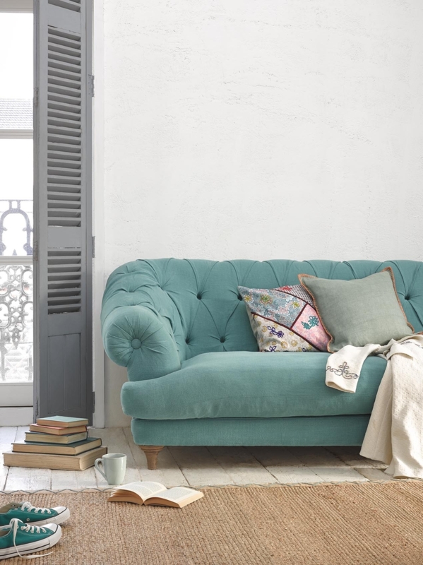 Cozy Aqua Blue Tufted Sofa with Decorative Cushions