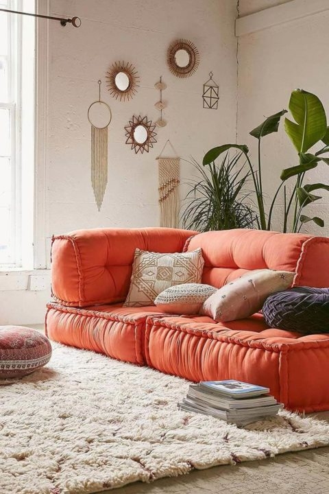 Cozy Orange Sofa with Boho Wall Decor