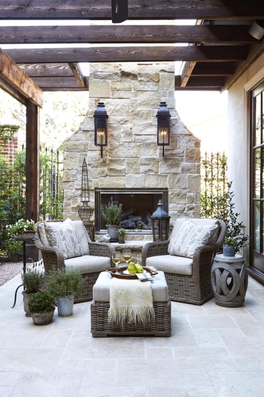 Cozy Outdoor Patio Seating with Stone Fireplace