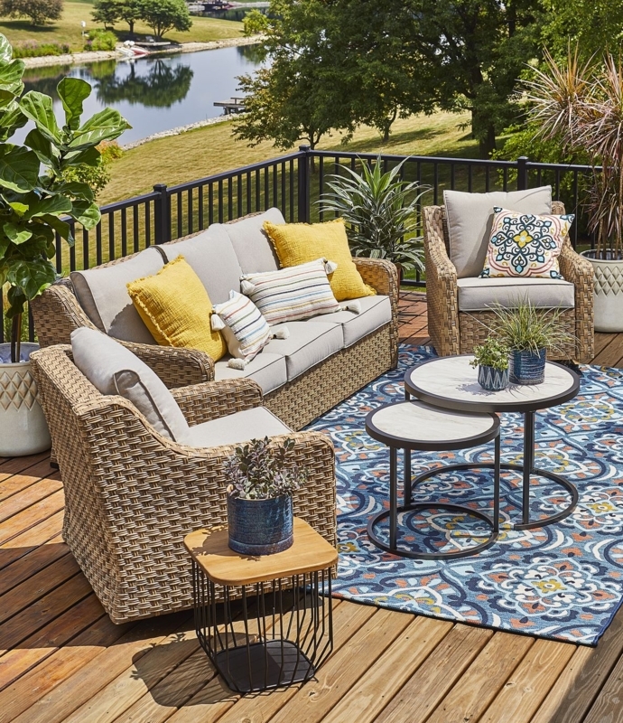 Cozy Outdoor Patio with Wicker Furniture and Colorful Rug