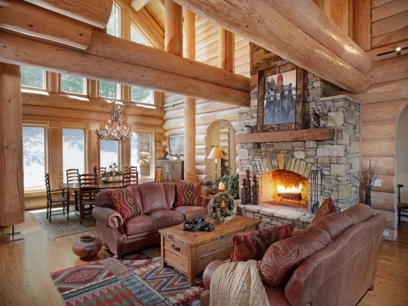 Cozy Rustic Cabin Living Room with Stone Fireplace