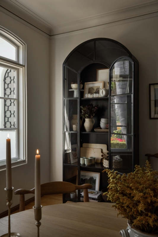 Elegant Black Arched Display Cabinet in Dining Room
