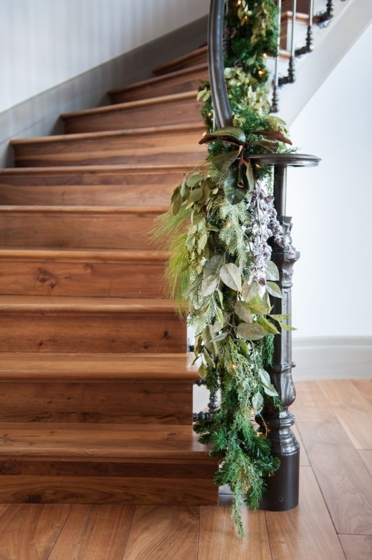 Elegant Christmas Garland on Wooden Stair Banister