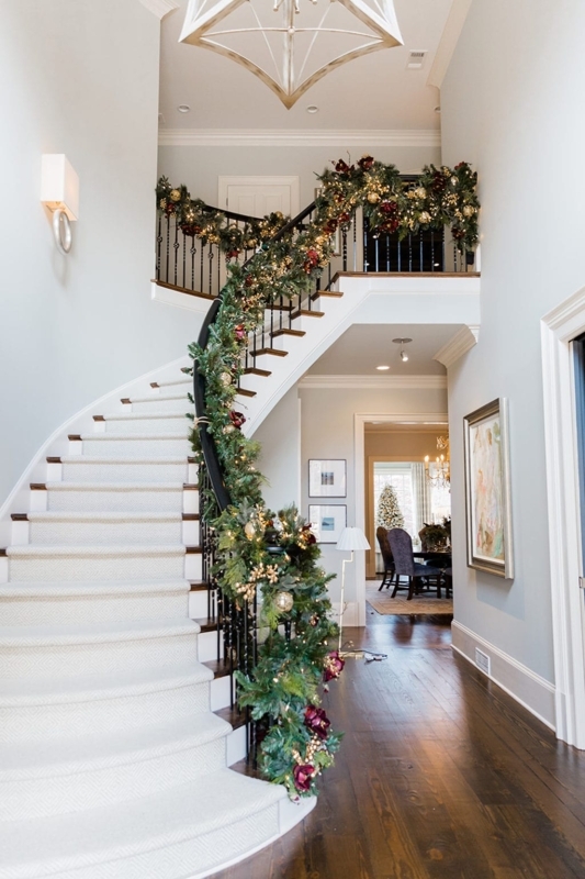 Elegant Double Christmas Garland on Curved Staircase