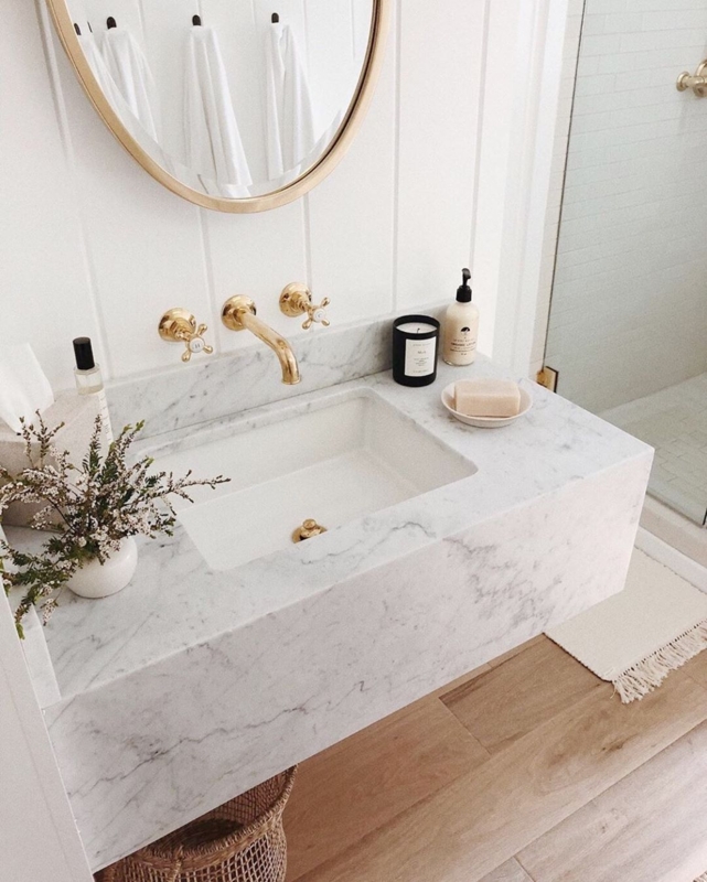Elegant Floating Marble Sink with Gold Fixtures