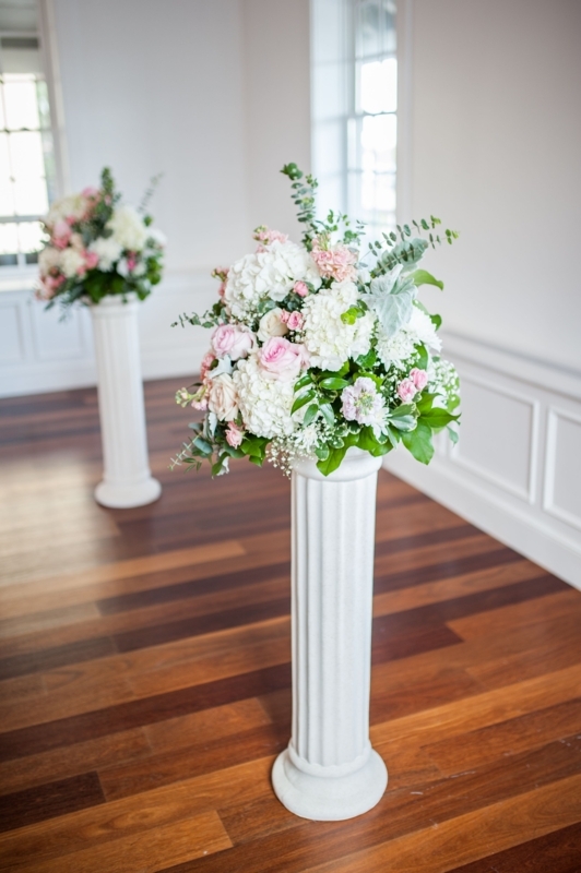 Elegant Floral Arrangements on Classic Column Pedestals