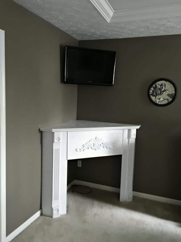 Elegant White Corner Fireplace Mantel Design