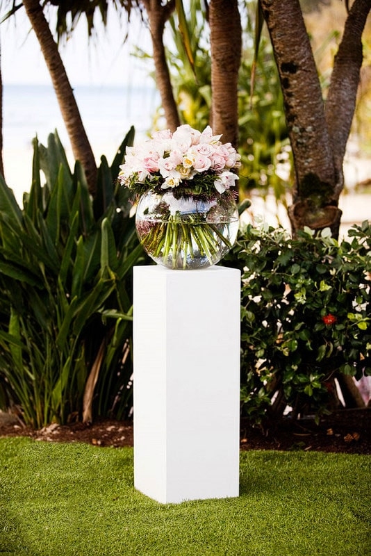 Elegant White Pedestal Display with Floral Arrangement