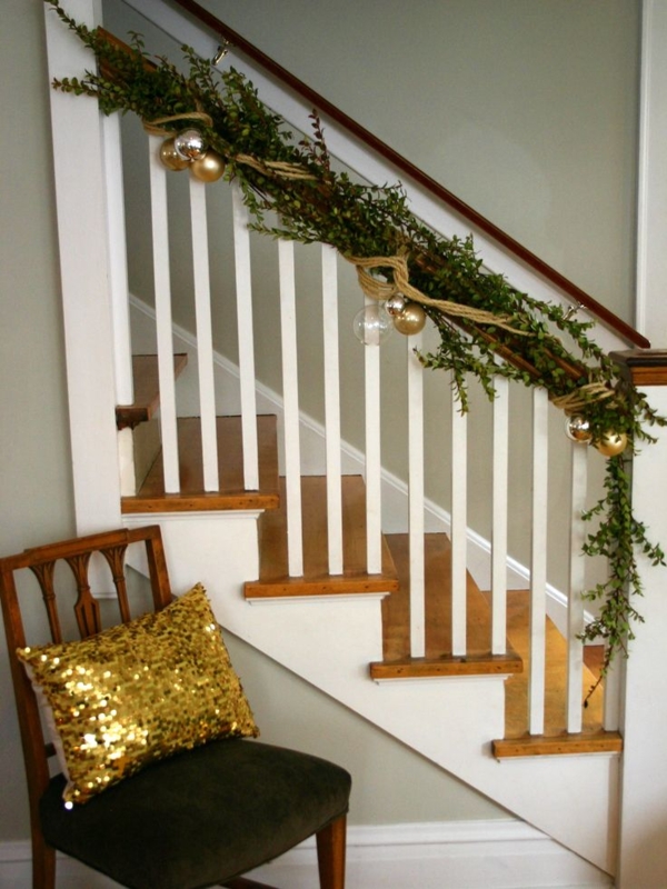 Festive Green Garland Decor on Stair Banister