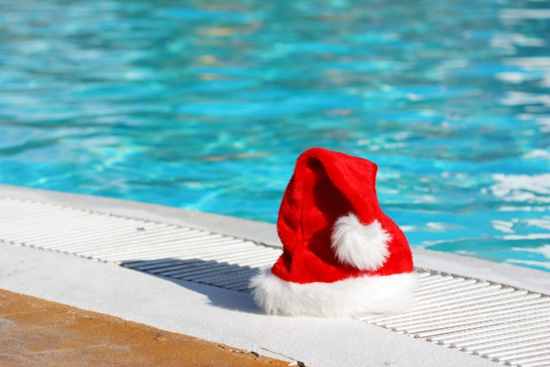 Festive Santa Hat by Sparkling Blue Pool