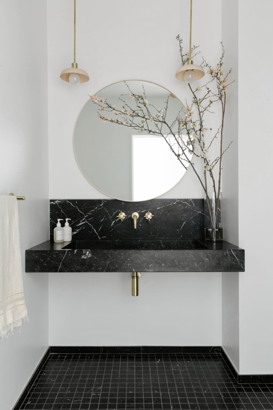 Floating Black Marble Vanity with Round Mirror