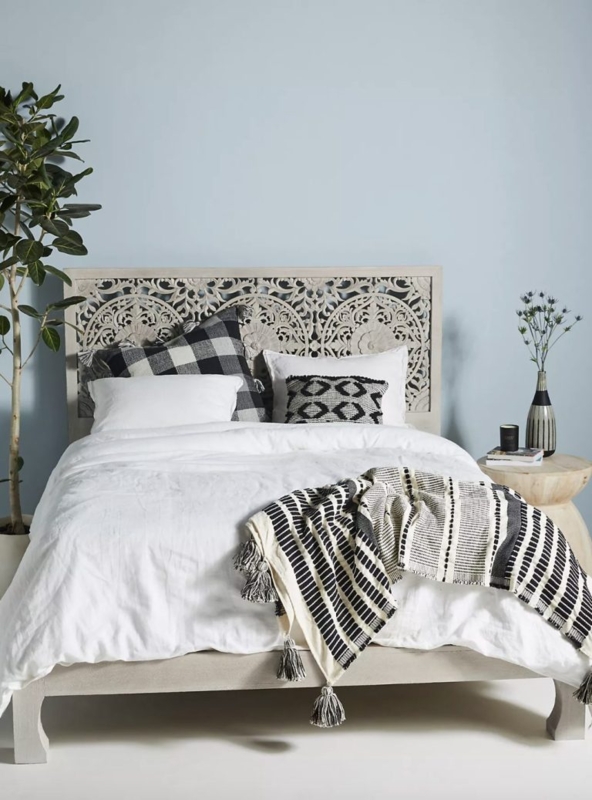 Intricately Carved Bohemian Bed Frame with Textured Accents