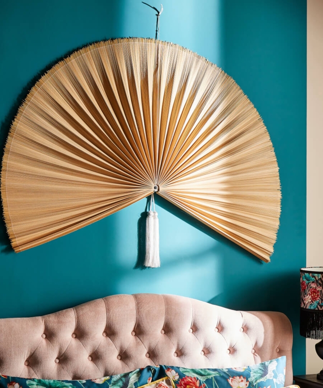 Large Decorative Fan Wall Art on Teal Wall
