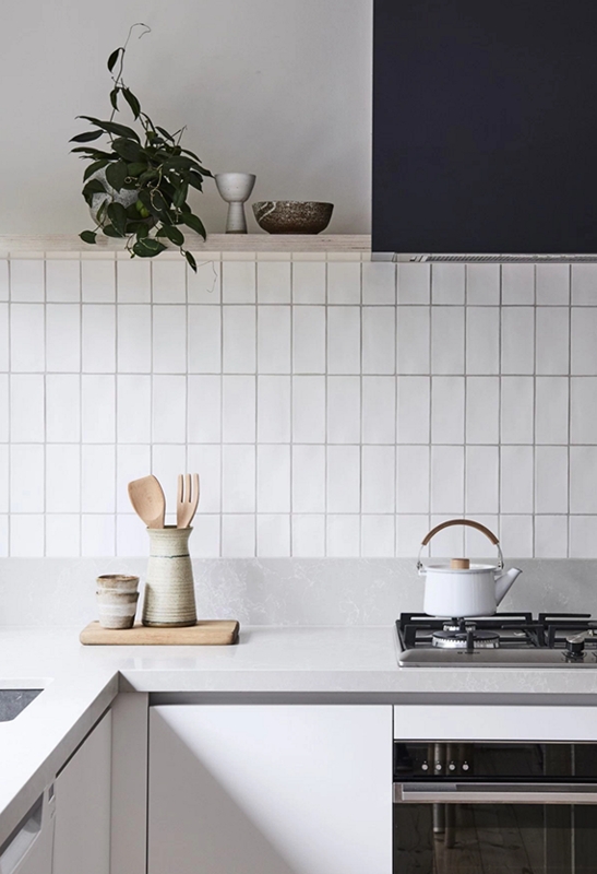Minimalist Kitchen with Vertical Subway Tile Backsplash