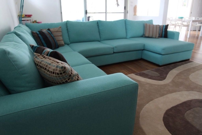 Modern Aqua Sectional Sofa with Patterned Pillows