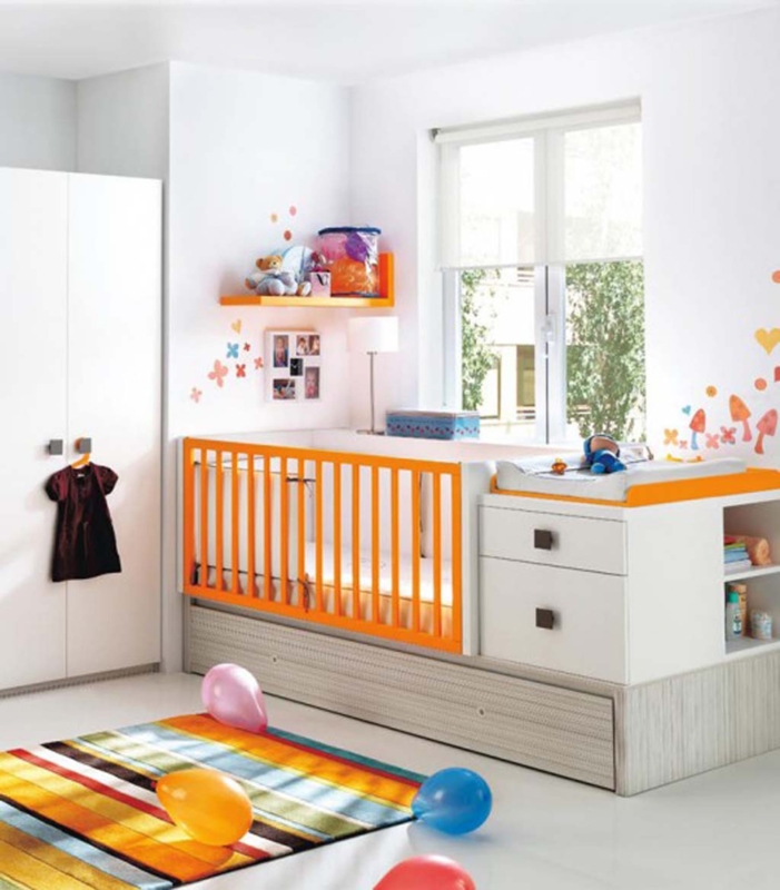 Modern Baby Crib with Orange Accents and Storage