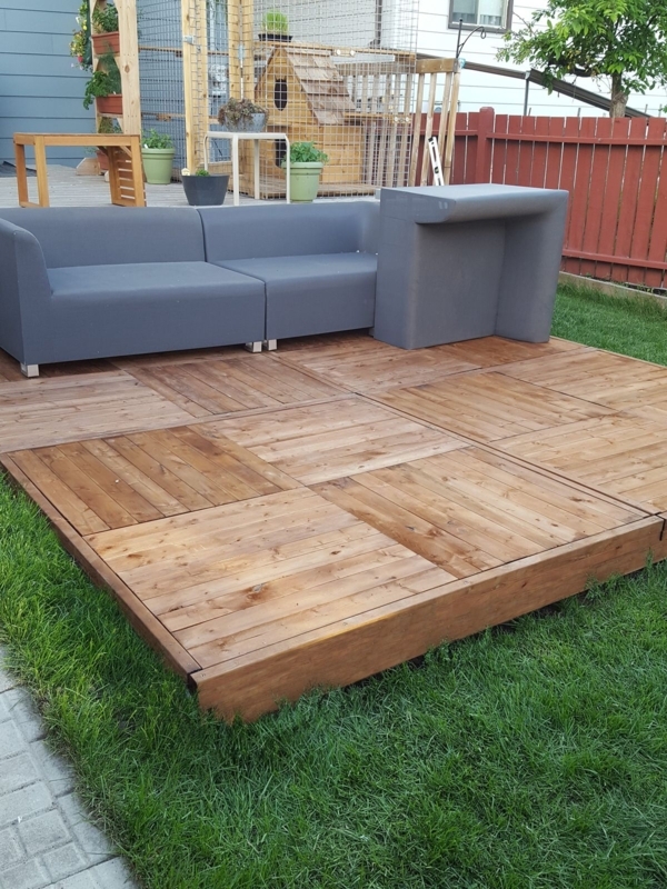 Modern Backyard with Wooden PVC Decking and Gray Sofa
