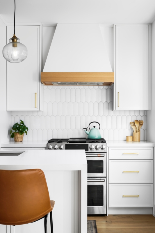 Modern White Kitchen with Vertical Tile Backsplash
