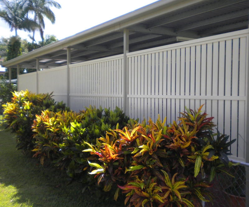 Modern White Slatted Carport Screens with Greenery
