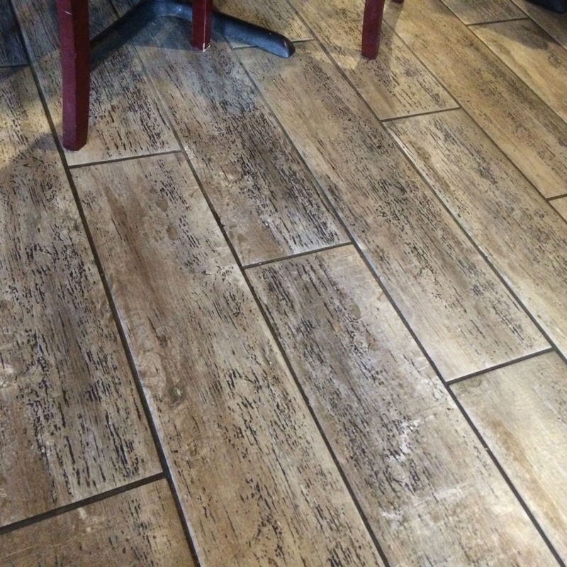 Realistic Carpet Mimicking Rustic Wood Flooring