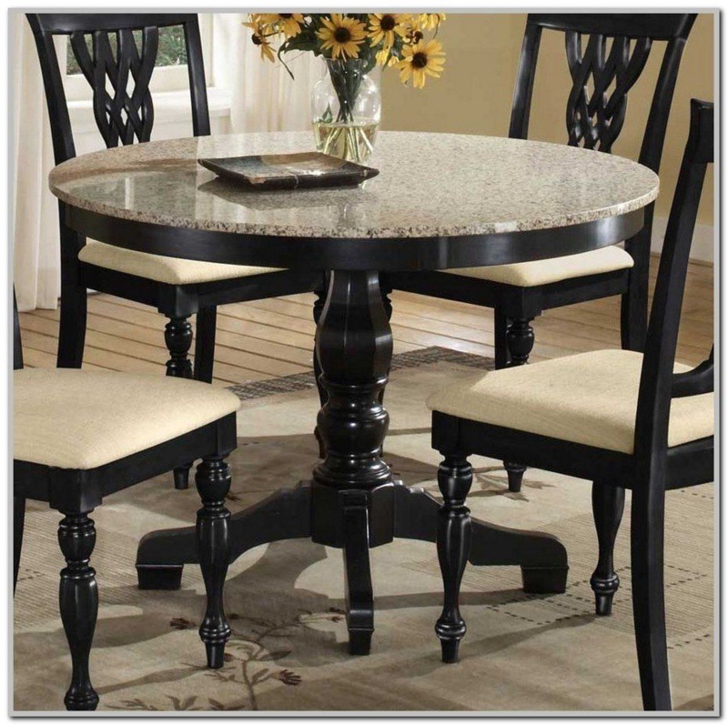 Round Marble Top Dining Table with Black Chairs
