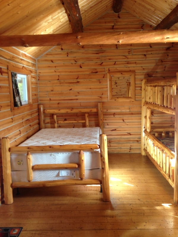 Rustic Log Cabin Bedroom with Bunk and Double Beds