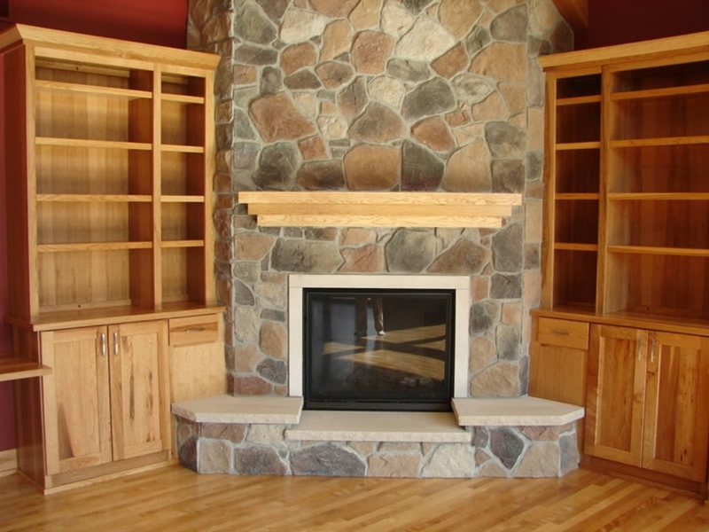 Rustic Stone Corner Fireplace with Wooden Mantel